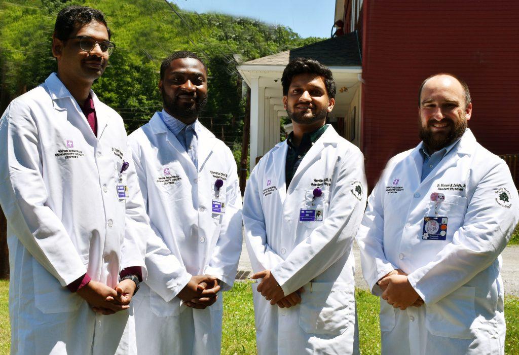 group of family medicine residents wearing white coats
